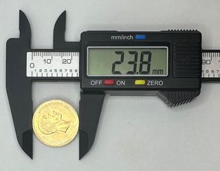 Moneda de oro de 21,6k, 7.97 g.