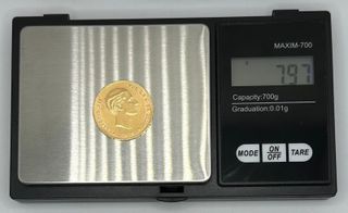 Moneda de oro de 21,6k, 7.97 g.