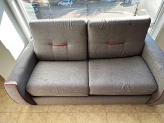 Sofá cama gris de tela