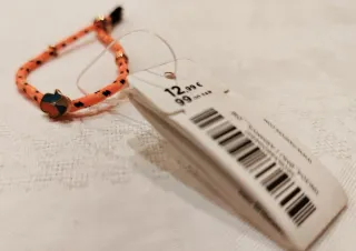 Bracciale Parfois arancione con ciondolo, nuovo.