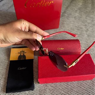 Occhiali da sole Cartier oro