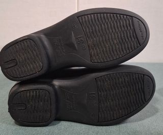 Botas de equitación negras.