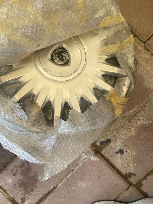 Tapacubos Lancia 15 seminuevos