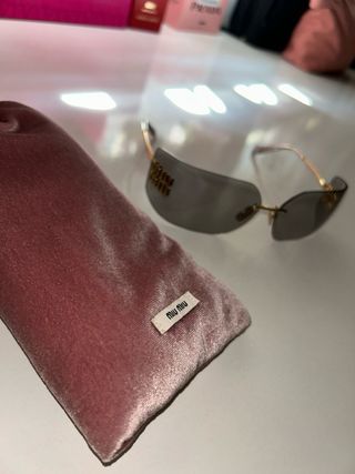 Gafas de sol Miu Miu doradas y grises