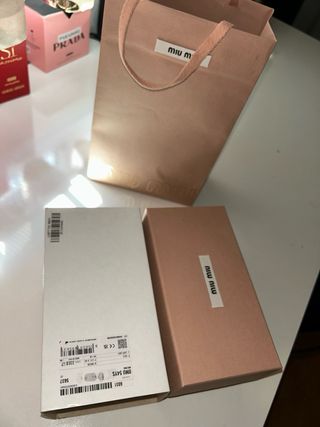 Gafas de sol Miu Miu doradas y grises