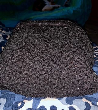 Clutch nera effetto peloso e lurex