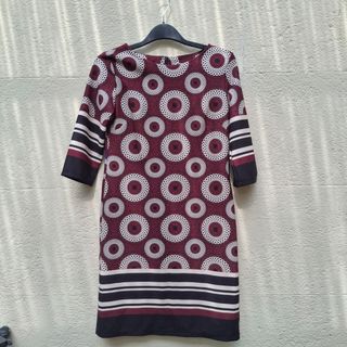 Abito fantasia cerchi rossi e bianchi