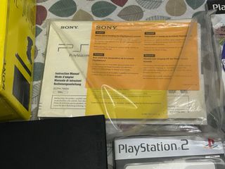 Consola PS2 Slim con caja, manuales y 11 juegos