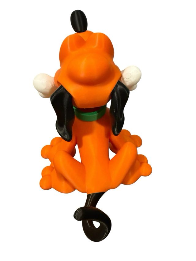 Figurita de Pluto con hueso