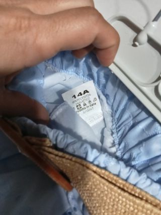 Completo top e shorts azzurri 14 anni