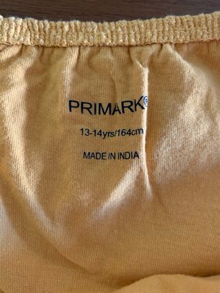 Camiseta niña mostaza con volantes