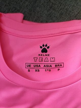 Conjunto deportivo Kelme rosa y blanco