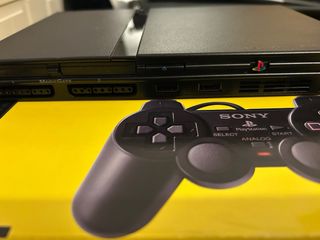 PlayStation 2 + Mandos Buzz + Juegos