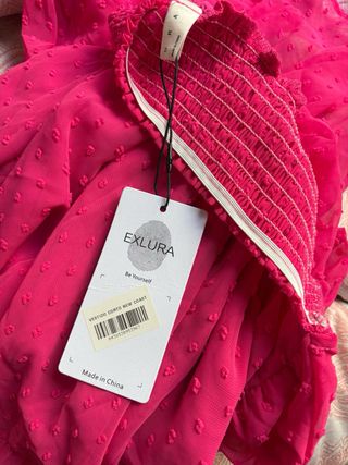 Vestido rosa /morado con volantes y lazada