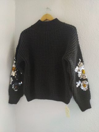 Jersey negro con lentejuelas doradas