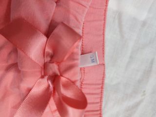 Pantaloni bambina rosa con fiocco