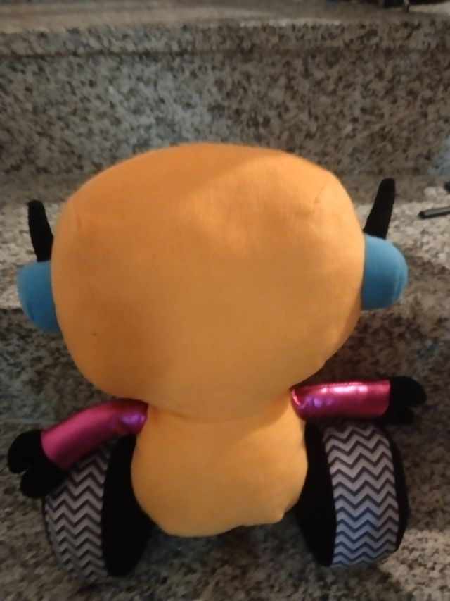 Peluche robot arancione con ruote