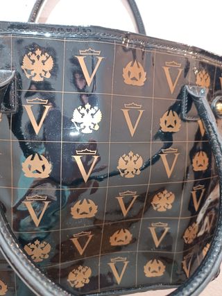 Bolso de mano mujer negro y dorado