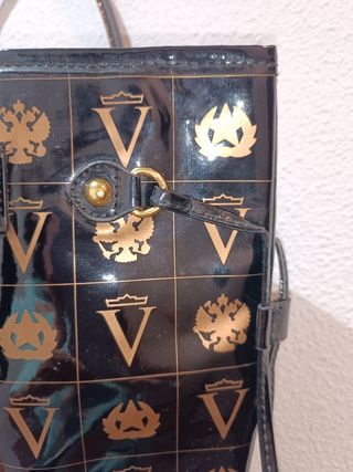 Bolso de mano mujer negro y dorado