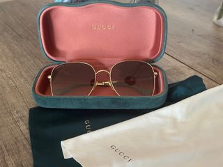 Gafas de sol Gucci doradas y marrones