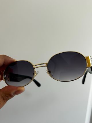 Occhiali da sole ovali vintage dorati