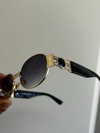 Occhiali da sole ovali vintage dorati