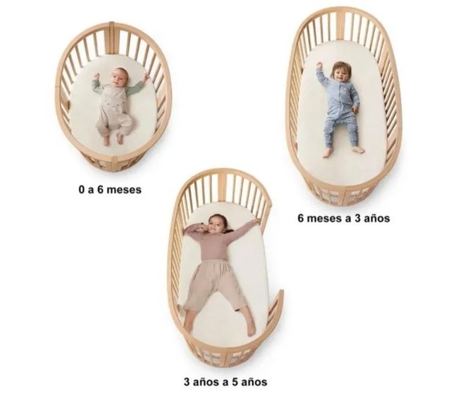 Cuna Stokke ovalada blanca y cambiador