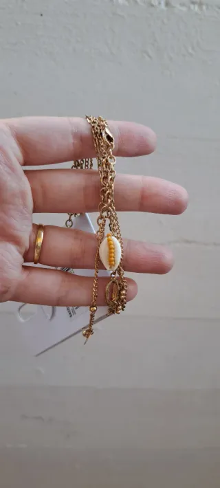 4 braccialetti Yamamay oro e bianchi