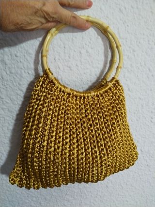 Bolso de mano dorado para eventos