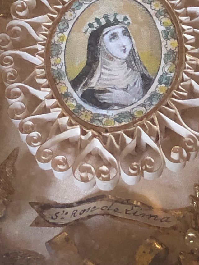 Marco de devoción con imagen religiosa