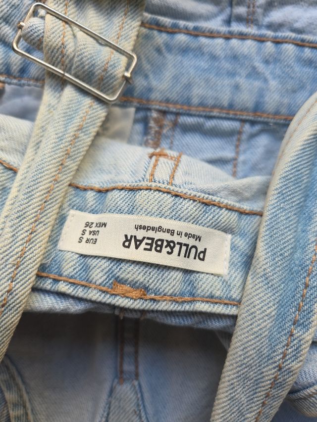 Peto vaquero corto desgastado