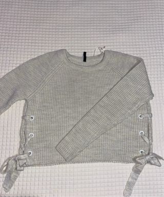 Jersey grueso beige con cordones laterales