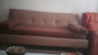 Sofá cama marrón de tela