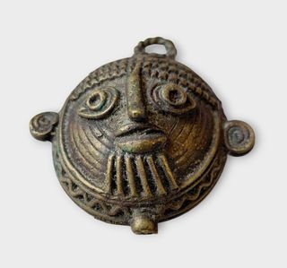 Medalla antigua de bronce – rostro tribal-