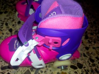 Patines de niña rosas y morados talla de 26 a 28
