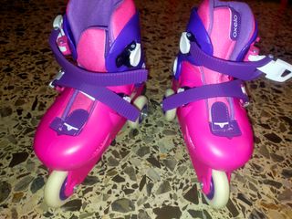 Patines de niña rosas y morados talla de 26 a 28
