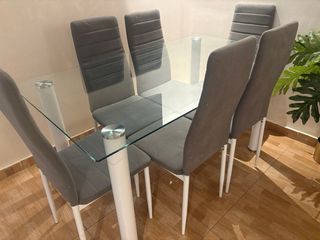 Mesa de comedor de cristal con 6 sillas