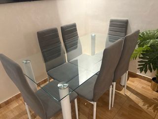 Mesa de comedor de cristal con 6 sillas