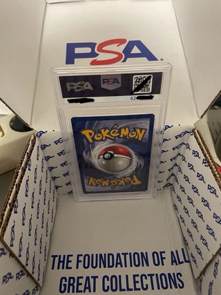 Carta Pokémon Chansey base set 1st Edition PSA 8