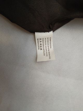 Bolso marrón, con flecos y tejido jaspeado