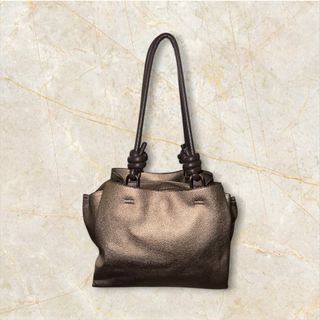Bolso Parfois elegante marrón y dorado