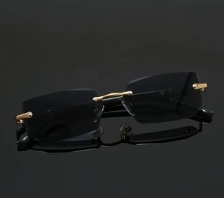 Gafas de sol sin montura doradas y negras