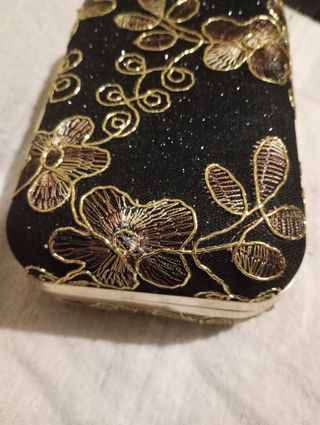 Bolso de fiesta negro y dorado