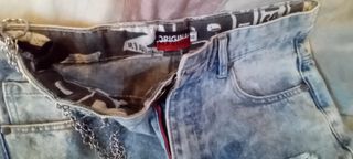 Jeans bambino strappati con catena