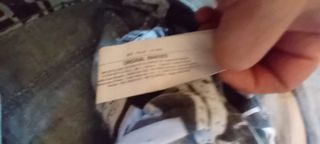 Jeans bambino strappati con catena