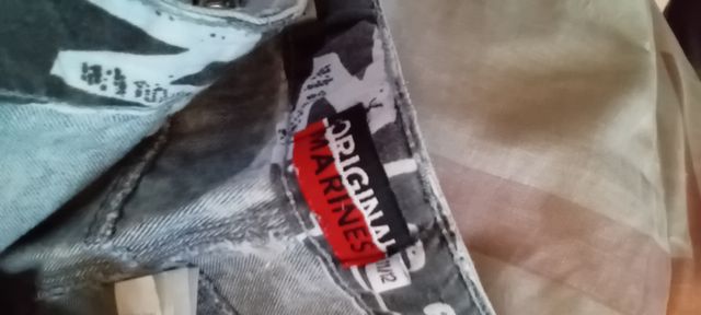 Jeans bambino strappati con catena