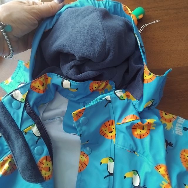 Giacca pioggia bimbo con leoni e tucani