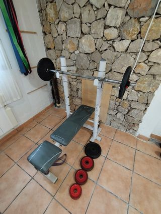 Banco de pesas con discos