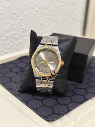 Reloj hombre dorado y plateado