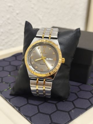 Reloj hombre dorado y plateado
